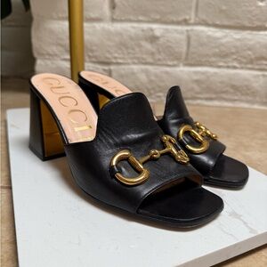 Gucci Black Leather Mules with Gold Accents